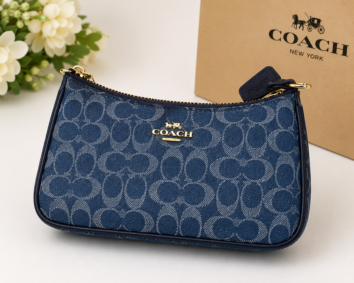 COACH navy blue signature denim wristlet pouch with gold-tone zipper and hardware