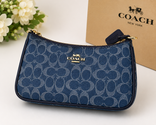 COACH navy blue signature denim wristlet pouch with gold-tone zipper and hardware