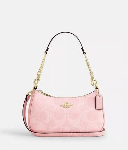 Coach Teri Shoulder Bag in Signature Canvas featuring the classic patterned design and shoulder strap