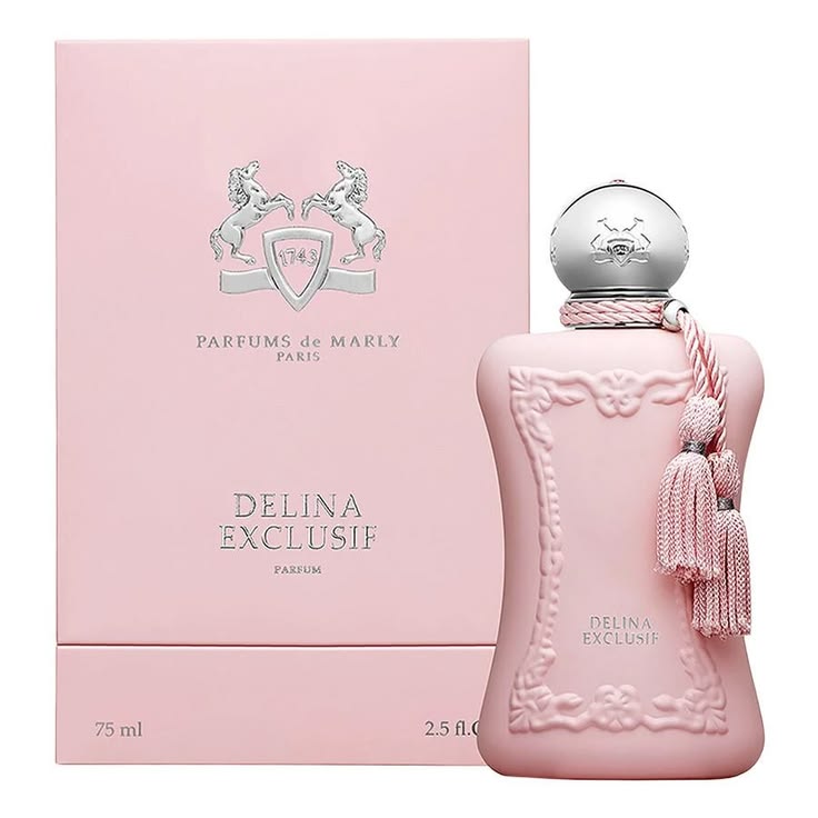 Pink perfume bottle with decorative elements and packaging on a white background
