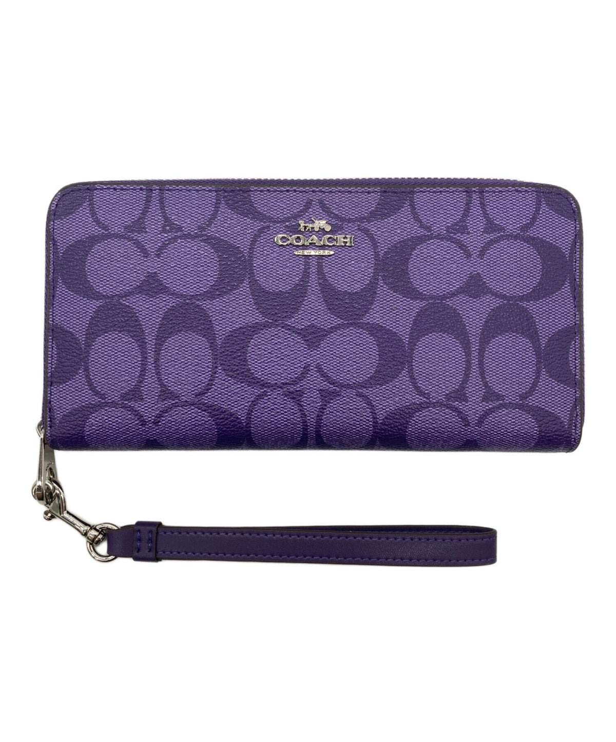 A purple Coach zip-around wallet with the signature C pattern and a wristlet strap, shown on a plain white background.
